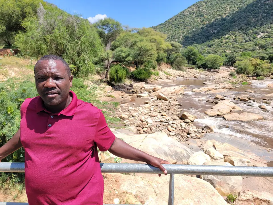 Standing at the bridge above the river