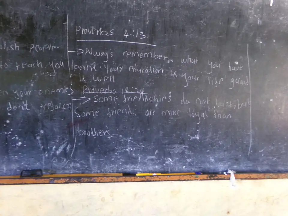 A classroom blackboard: “Always remember, after you leave, your education is your life goal”